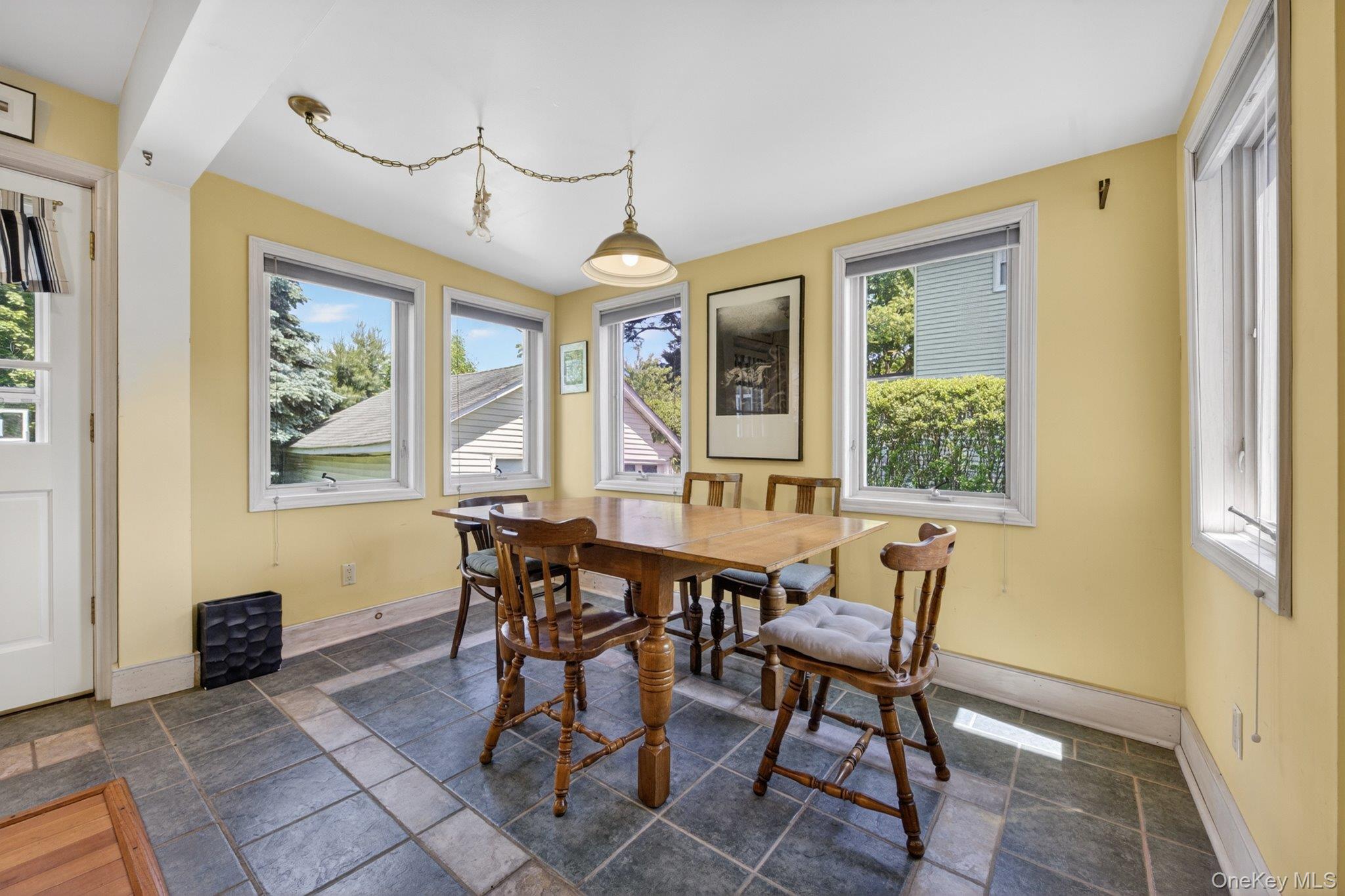 250 Rombout Avenue Beacon, NY 12508 - Photo 14 of 33 a view of a dining room with furniture window and outside view