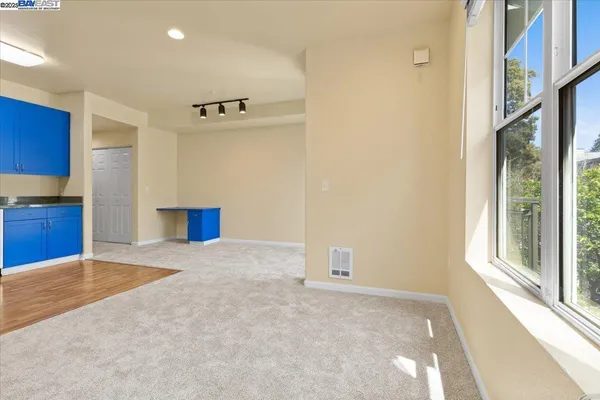 a view of an empty room with a window