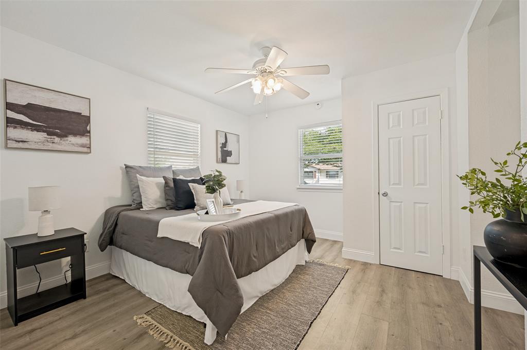 2316 Cunningham Street Irving, TX 75062 - Photo 10 of 22 Bright room featuring light wood-finish flooring, white walls, and a ceiling fan