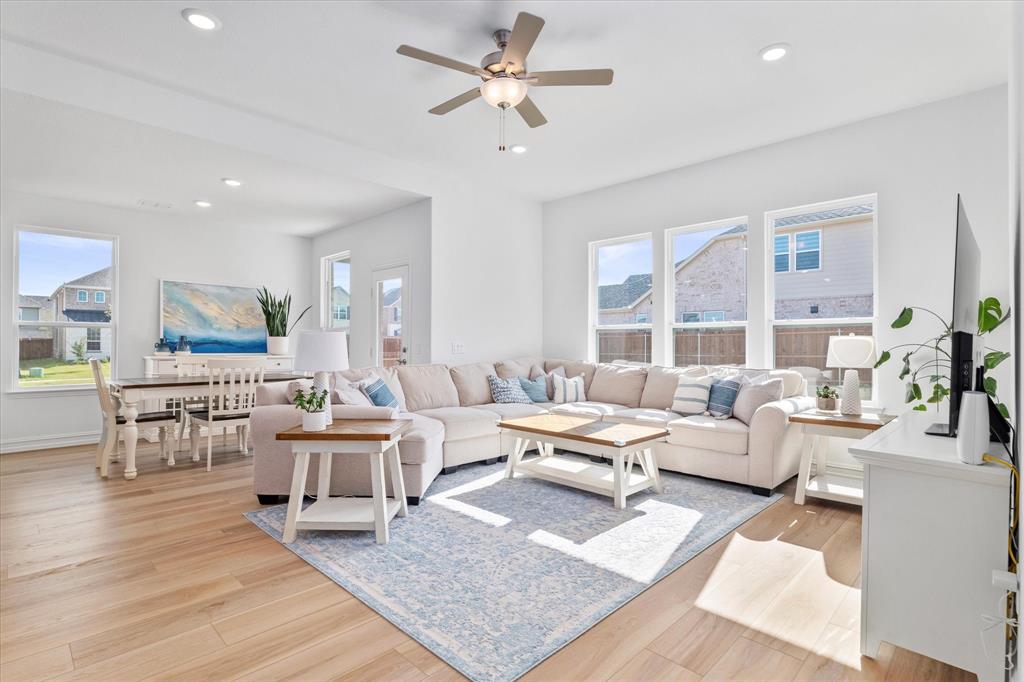 4001 Maida Road McKinney, TX 75071 - Photo 17 of 36 a living room with lots of furniture and a wooden floor