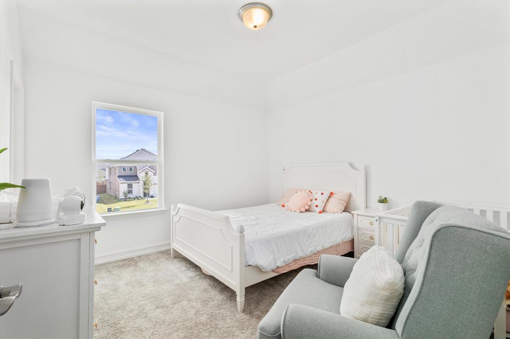 4001 Maida Road McKinney, TX 75071 - Photo 31 of 36 a bedroom with furniture and a window