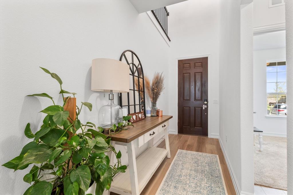 4001 Maida Road McKinney, TX 75071 - Photo 6 of 36 a room with white cabinets and a potted plant