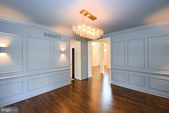 a kitchen with stainless steel appliances granite countertop a refrigerator stove and sink