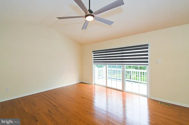 a bathroom with a granite countertop sink mirror and toilet