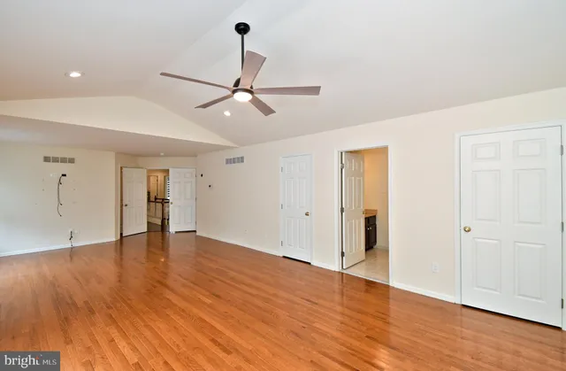 a view of a kitchen with a sink wooden floor and staircase
