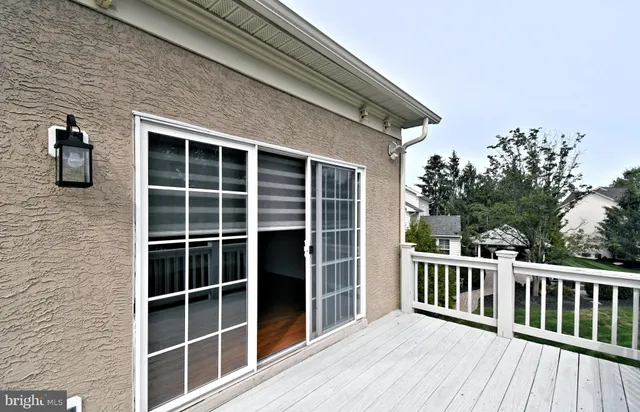 a front view of a house with a yard and outdoor seating
