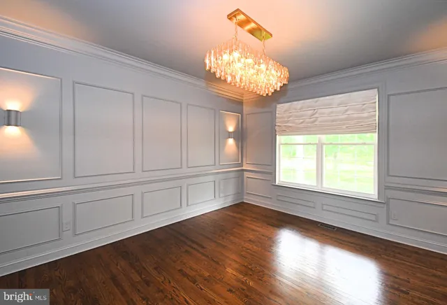 a kitchen with stainless steel appliances granite countertop a sink refrigerator and cabinets