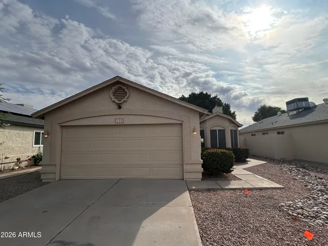 a front view of a house with garage