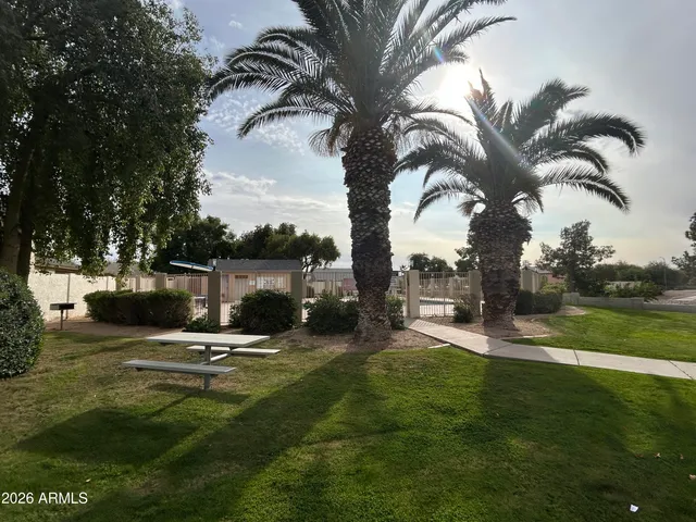 a view of a park with swings and slides
