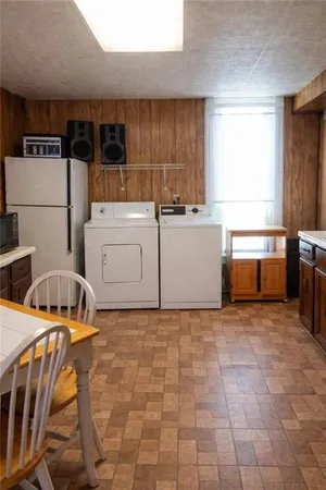 a kitchen with stainless steel appliances a stove a sink a microwave a counter top and cabinets