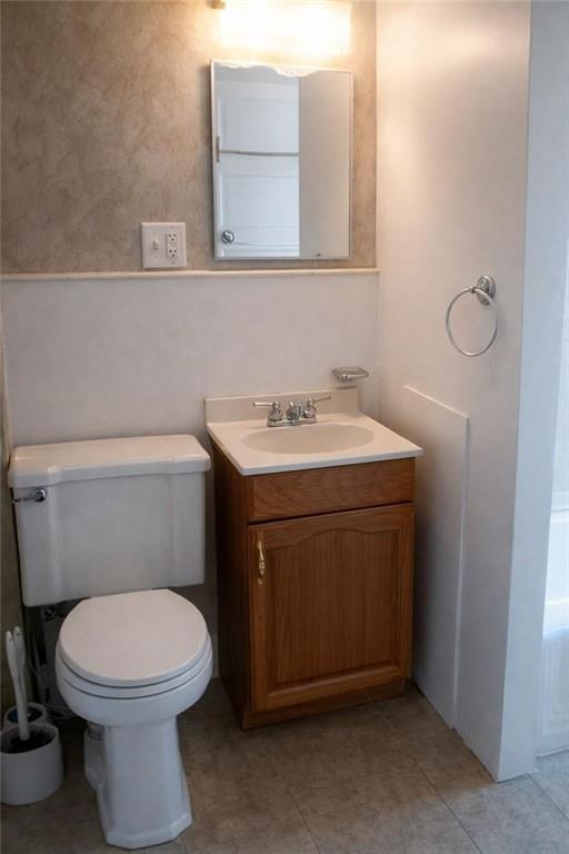 2024 7th Avenue Beaver Falls, PA 15010 - Photo 6 of 8 a bathroom with a toilet sink and mirror