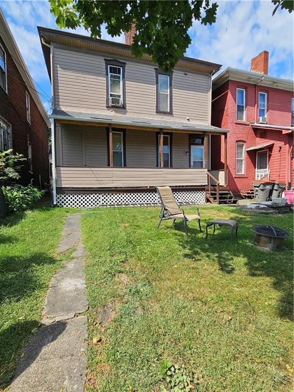 2024 7th Avenue Beaver Falls, PA 15010 - Photo 7 of 8 a front view of a house with a yard