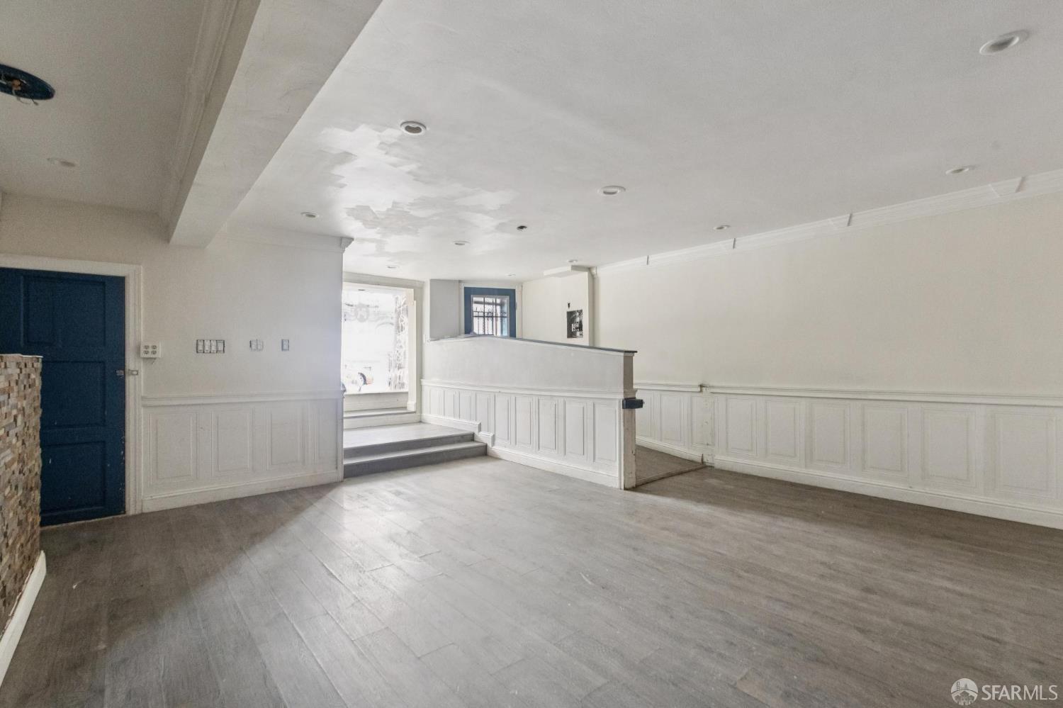 974-980 Sutter Street San Francisco, CA 94109 - Photo 8 of 9 an empty room with wooden floor and windows