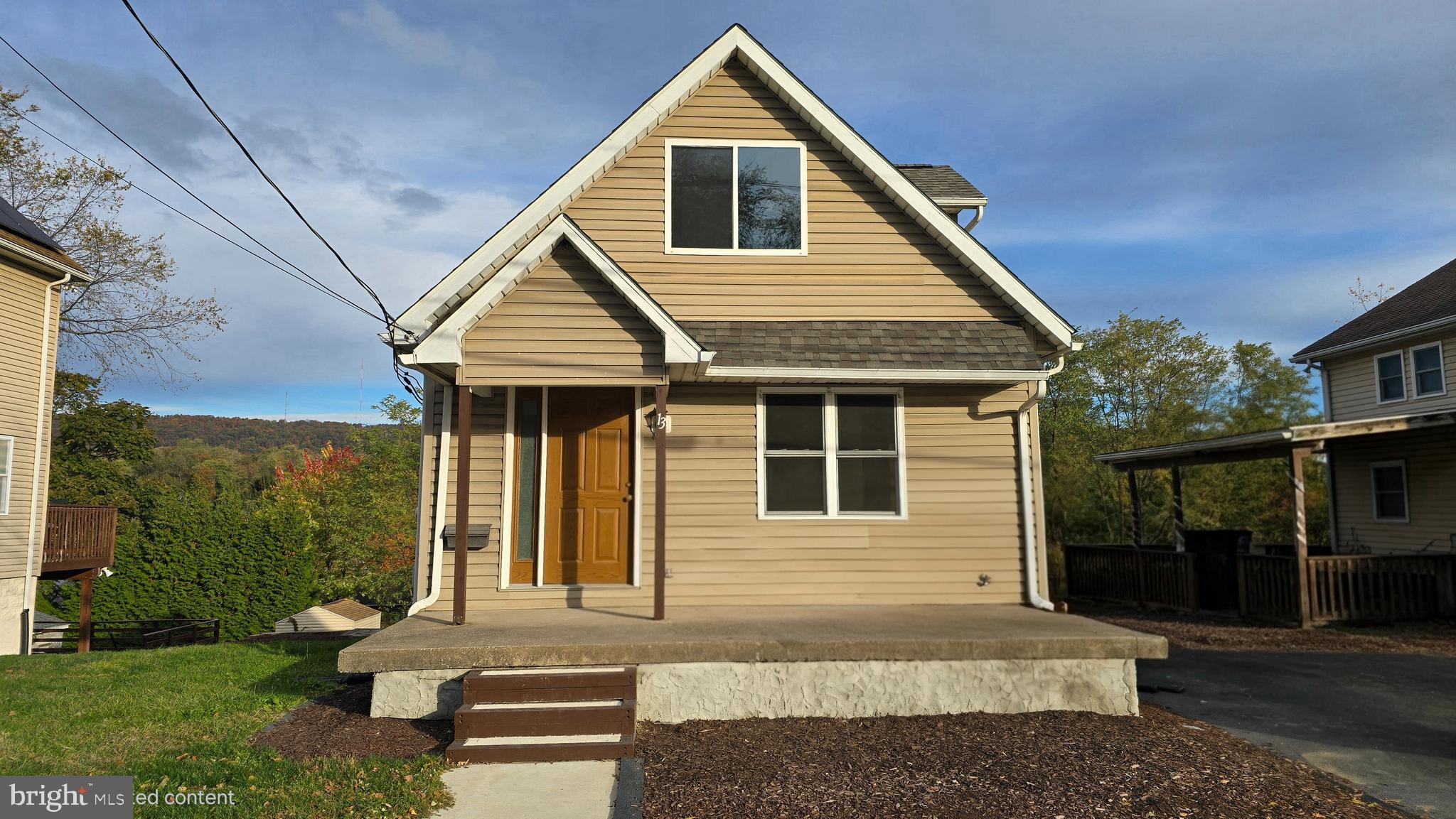 a front view of a house with a yard