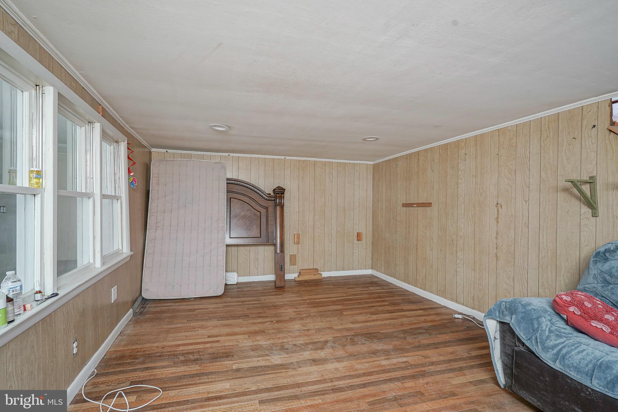 4 Oak Street Salem, NJ 08079 - Photo 5 of 34 a view of empty room with wooden floor and fan