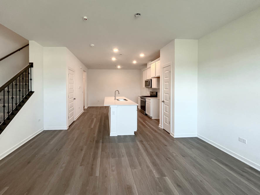 2116 Bodega Drive Oswego, IL 60543 - Photo 5 of 36 a view of a kitchen with wooden floor