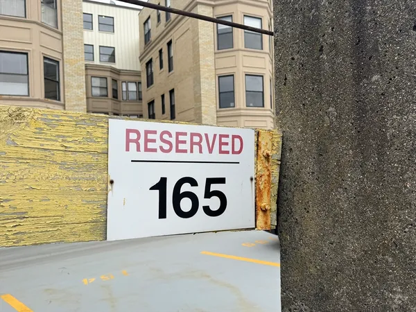 a sign that is on a brick wall