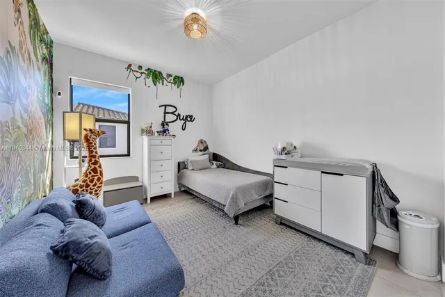 a bathroom with a sink a large mirror and a bathtub
