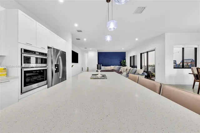 a large white bed in a hotel room