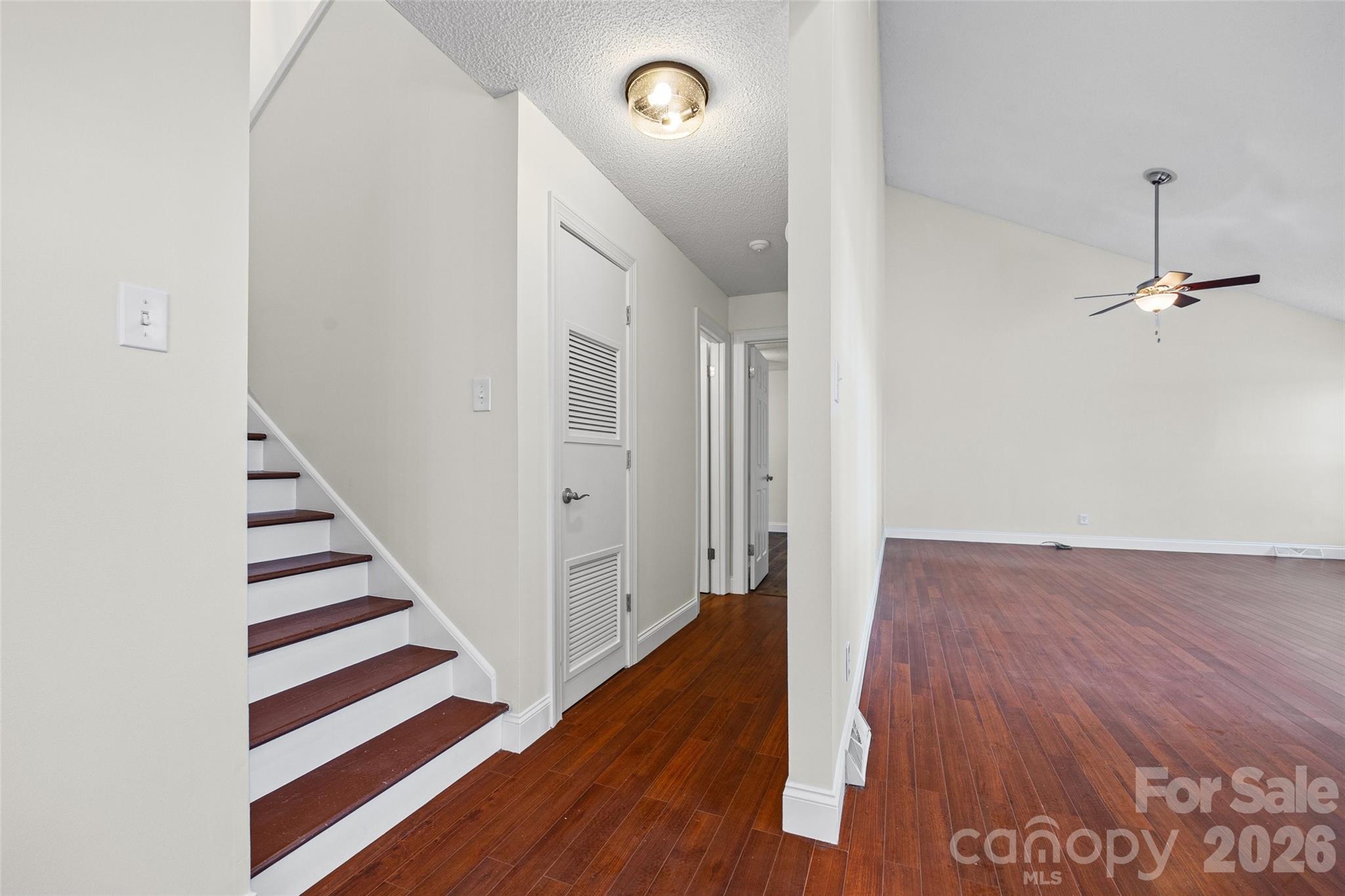 16149 Haroa Court Fort Mill, SC 29708 - Photo 18 of 43 a view of a hallway with wooden floor and staircase
