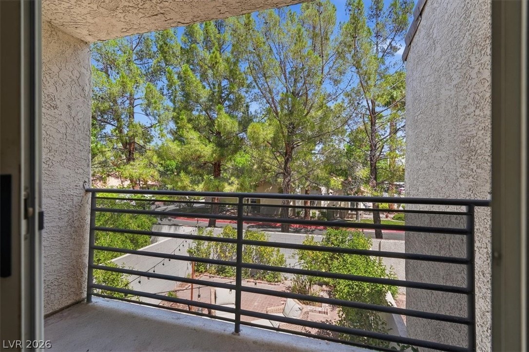 6250 West Flamingo Road, Unit 93 Las Vegas, NV 89103 - Photo 31 of 38 This tranquil outdoor space provides serene views of lush trees.