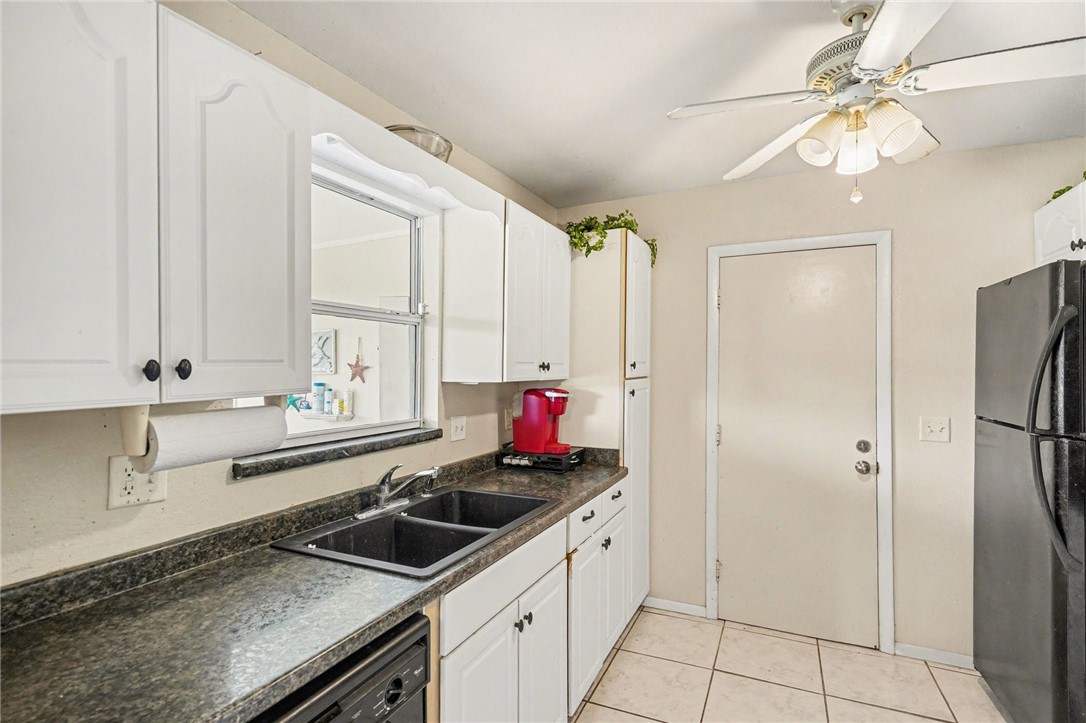 748 Cranbrook Avenue Northeast Palm Bay, FL 32905 - Photo 12 of 26 a kitchen with stainless steel appliances a sink stove and refrigerator