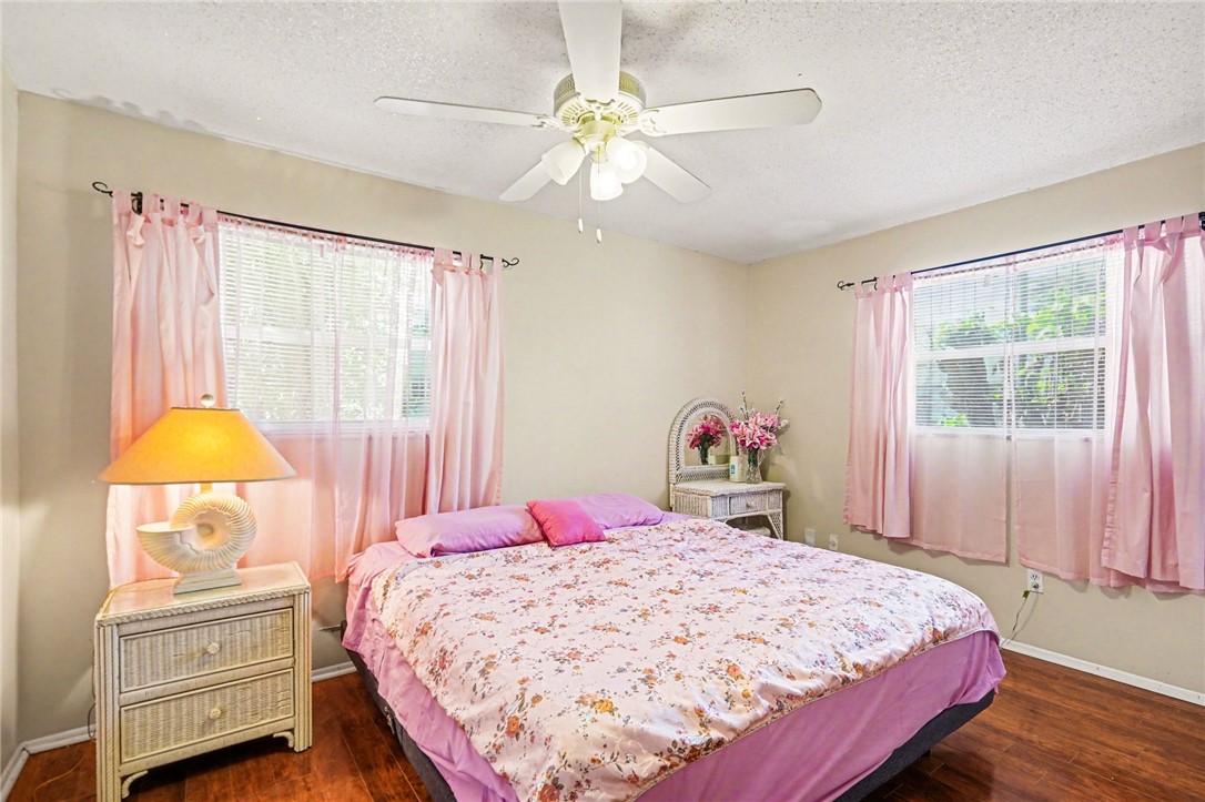 748 Cranbrook Avenue Northeast Palm Bay, FL 32905 - Photo 13 of 26 a bed sitting in a bedroom next to a window