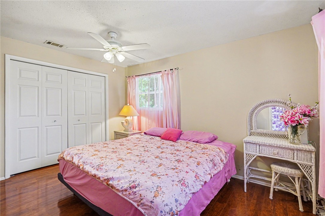 748 Cranbrook Avenue Northeast Palm Bay, FL 32905 - Photo 16 of 26 a bedroom with a bed dresser and a window