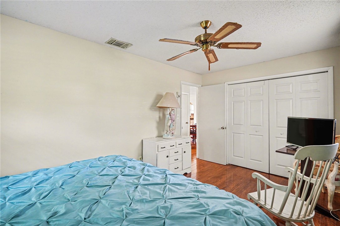 748 Cranbrook Avenue Northeast Palm Bay, FL 32905 - Photo 18 of 26 a bedroom with a bed and a flat screen tv