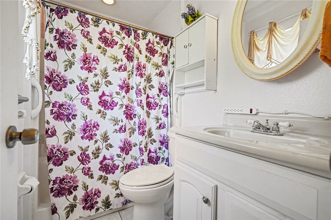 748 Cranbrook Avenue Northeast Palm Bay, FL 32905 - Photo 20 of 26 a bathroom with a sink and a mirror