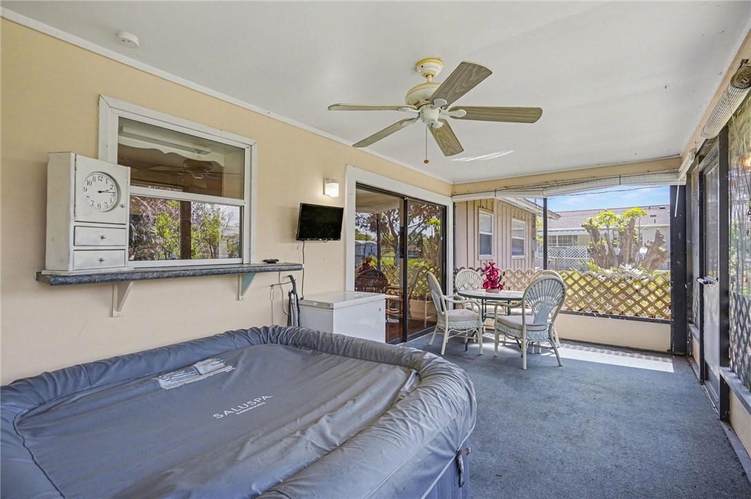 748 Cranbrook Avenue Northeast Palm Bay, FL 32905 - Photo 22 of 26 a living room with furniture and a flat screen tv