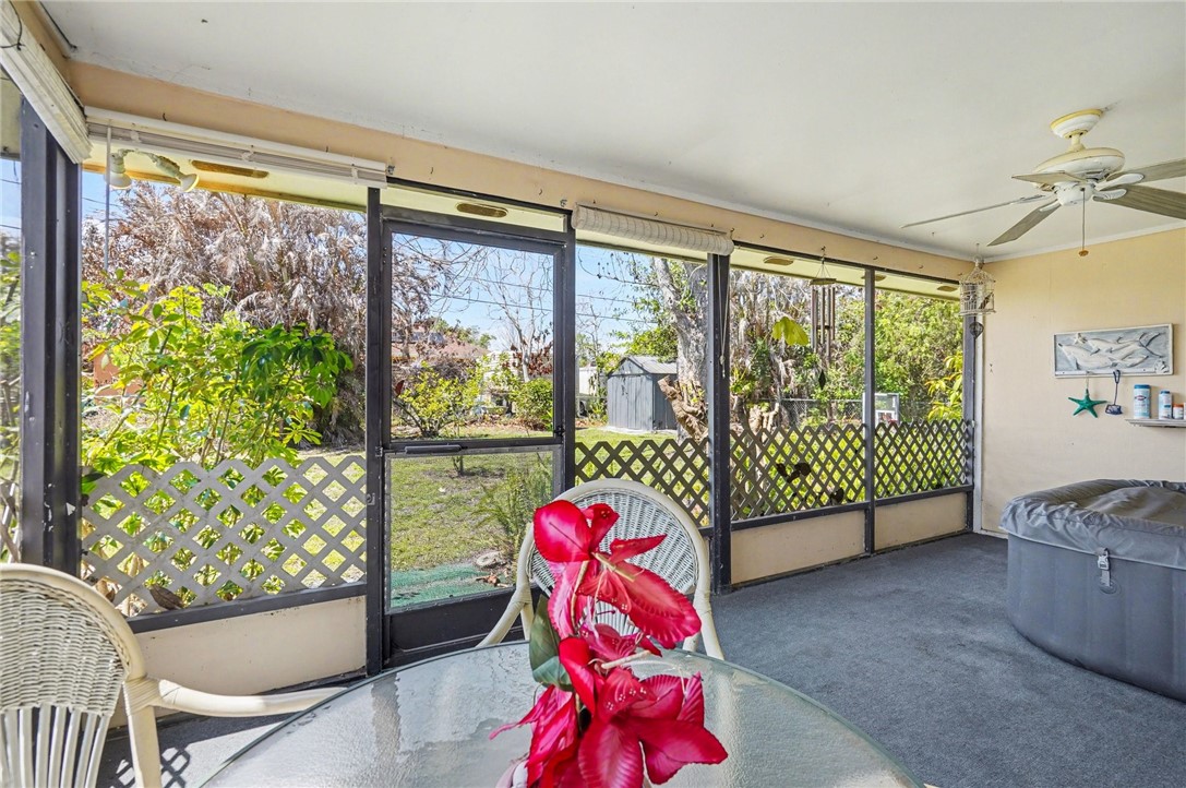 748 Cranbrook Avenue Northeast Palm Bay, FL 32905 - Photo 23 of 26 a living room with a large window and outer view