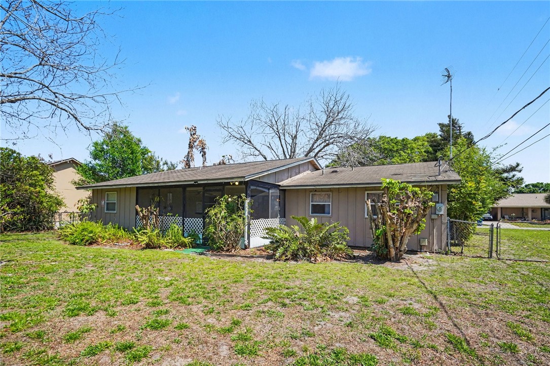 748 Cranbrook Avenue Northeast Palm Bay, FL 32905 - Photo 25 of 26 a front view of house with yard and green space
