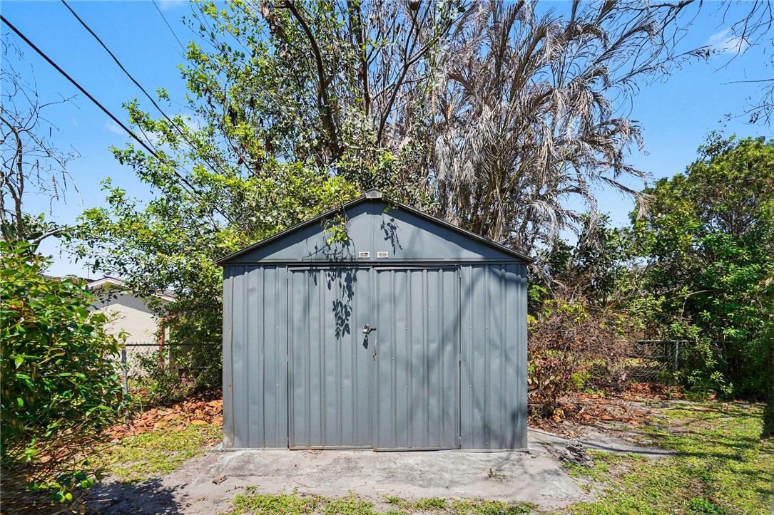 748 Cranbrook Avenue Northeast Palm Bay, FL 32905 - Photo 26 of 26 a view of wooden house with a trees
