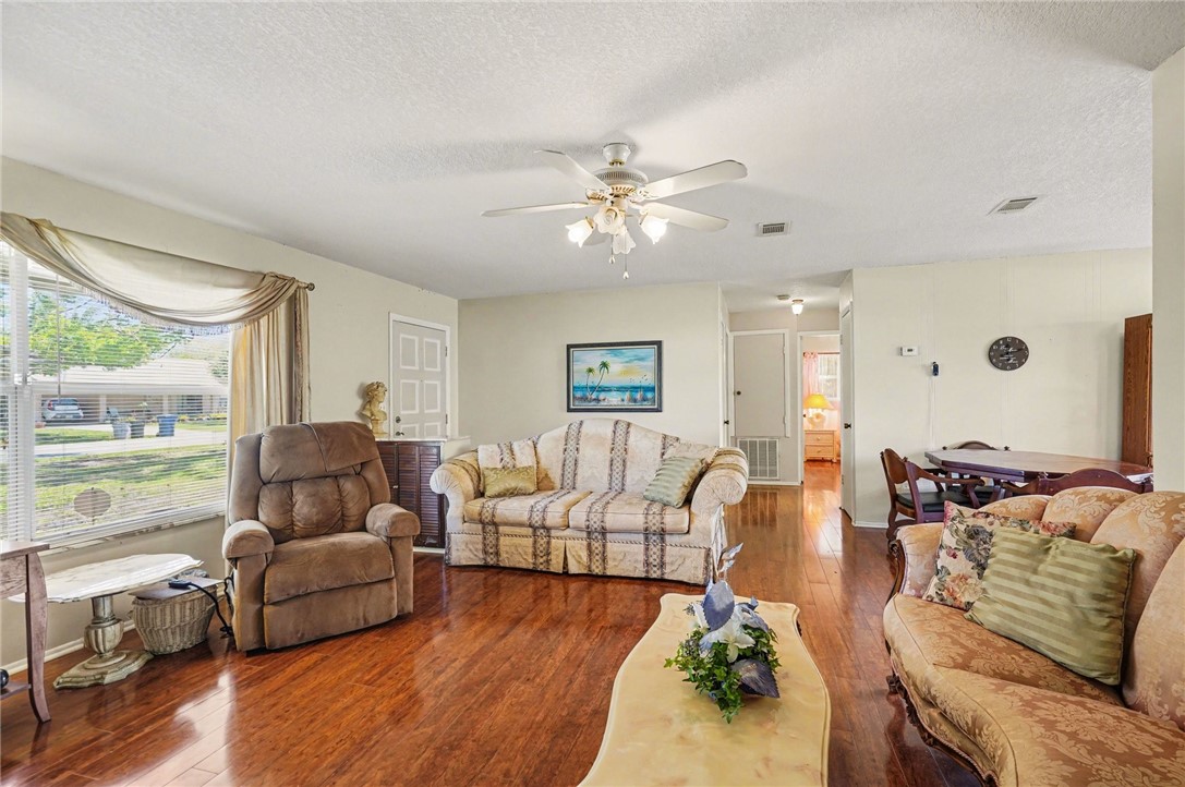 748 Cranbrook Avenue Northeast Palm Bay, FL 32905 - Photo 7 of 26 a living room with furniture and a large window
