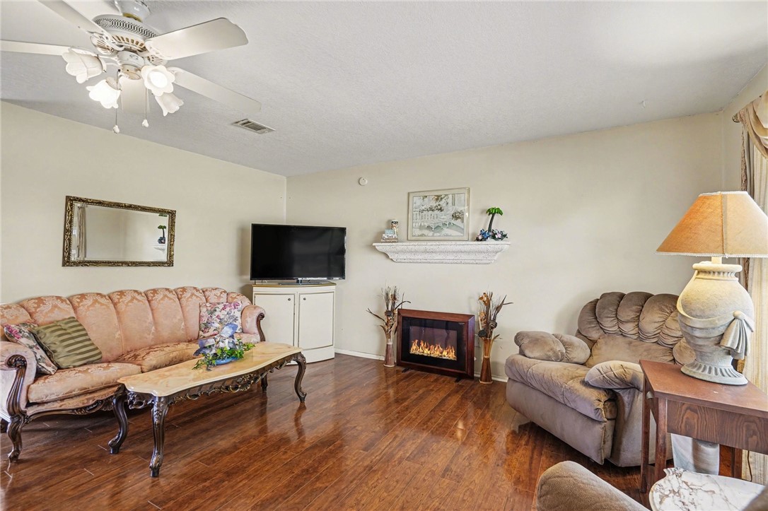 748 Cranbrook Avenue Northeast Palm Bay, FL 32905 - Photo 8 of 26 a living room with furniture and a flat screen tv