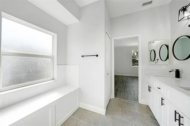 an aerial view of a house with swimming pool garden and patio
