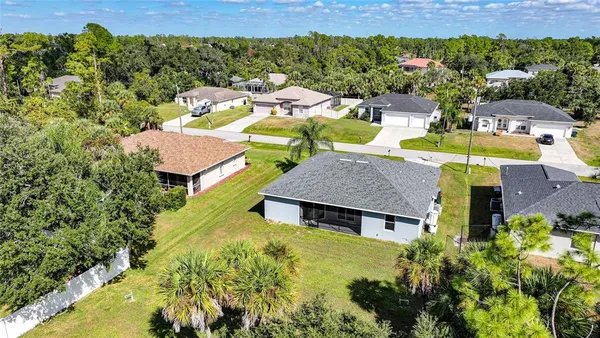an aerial view of a house with a garden