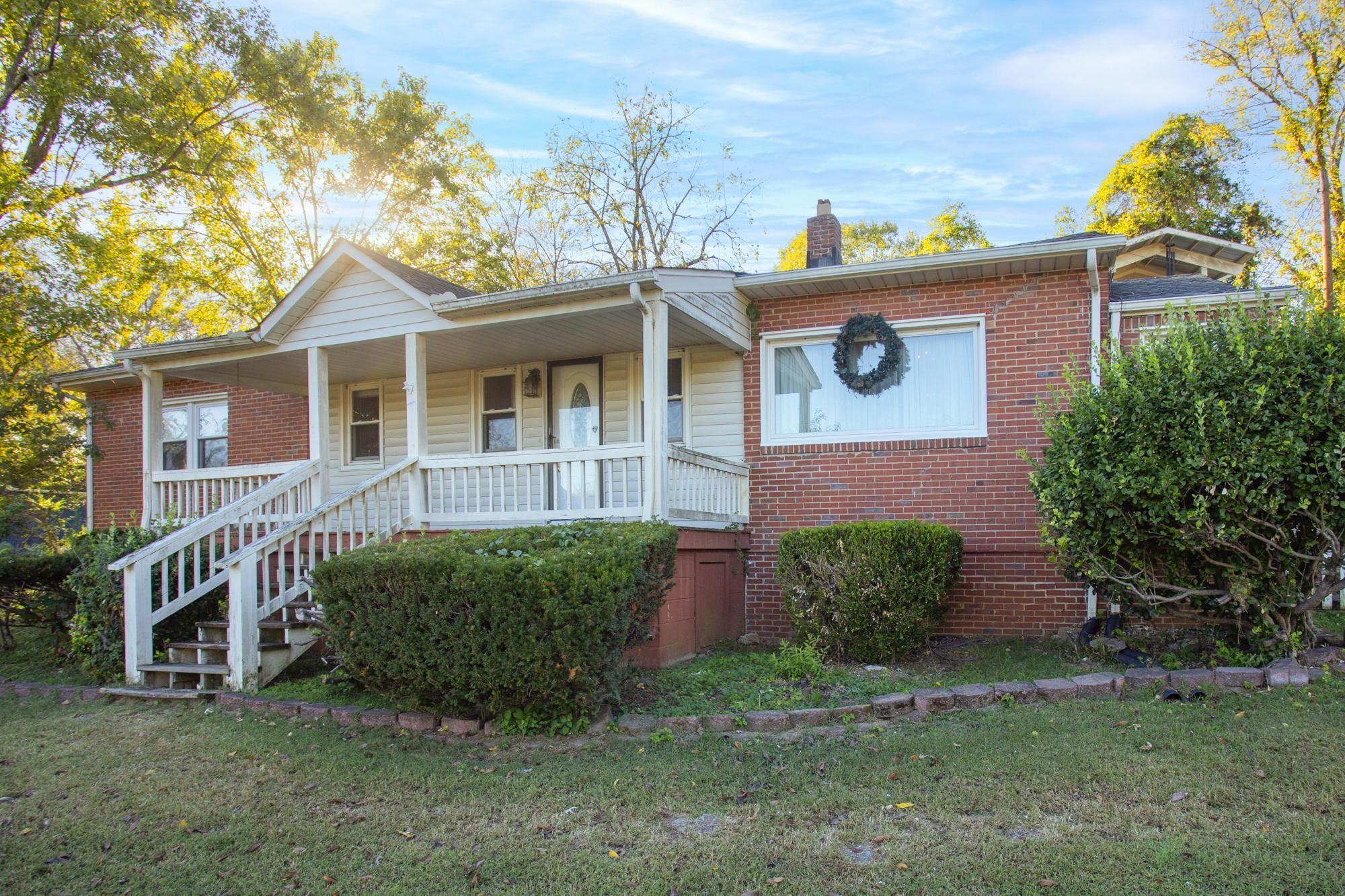 1700 Riverside Road Old Hickory, TN 37138 - Photo 1 of 59 a front view of a house with garden