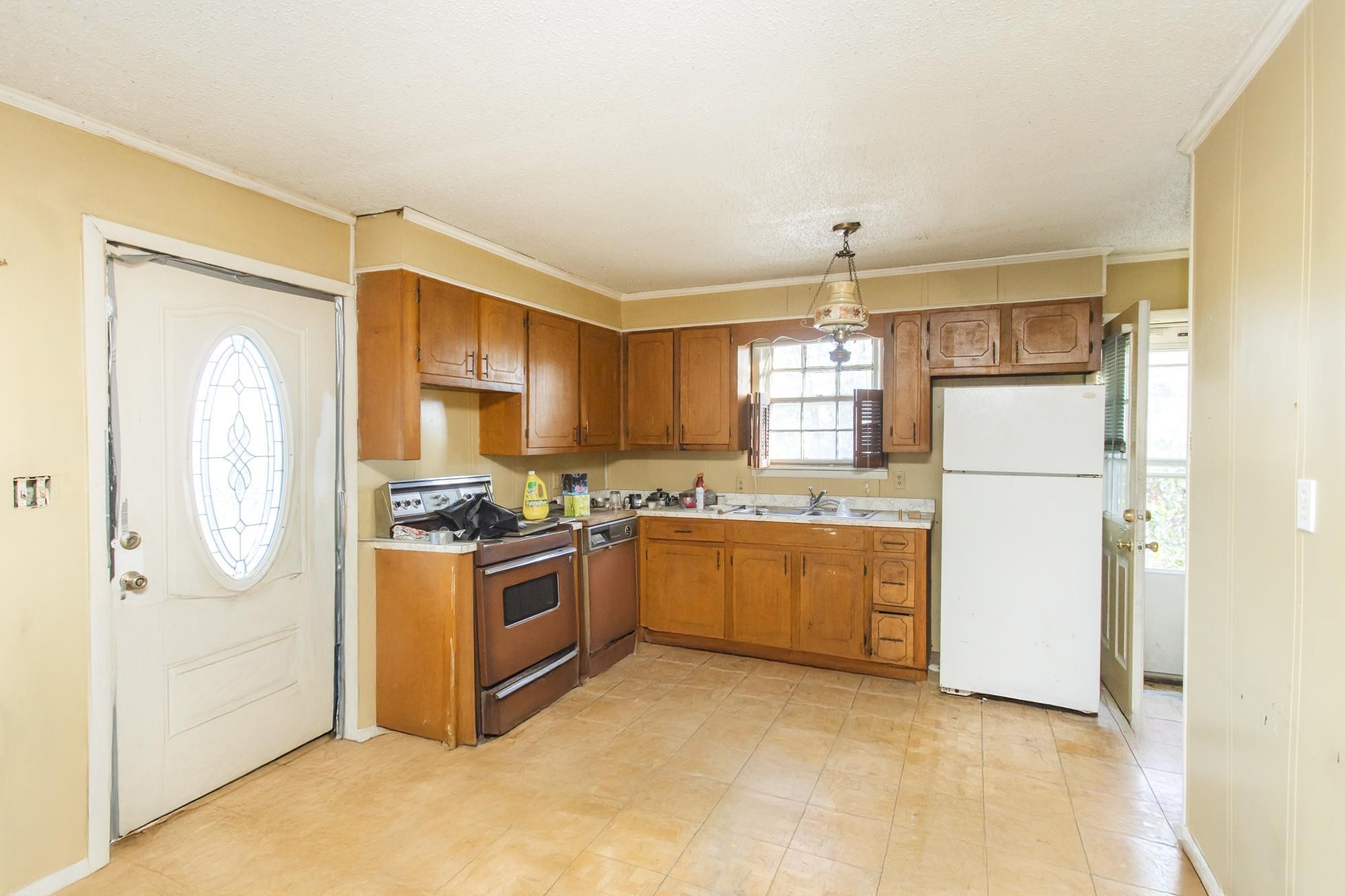 1700 Riverside Road Old Hickory, TN 37138 - Photo 31 of 59 a kitchen with stainless steel appliances granite countertop a refrigerator a stove a sink and a microwave