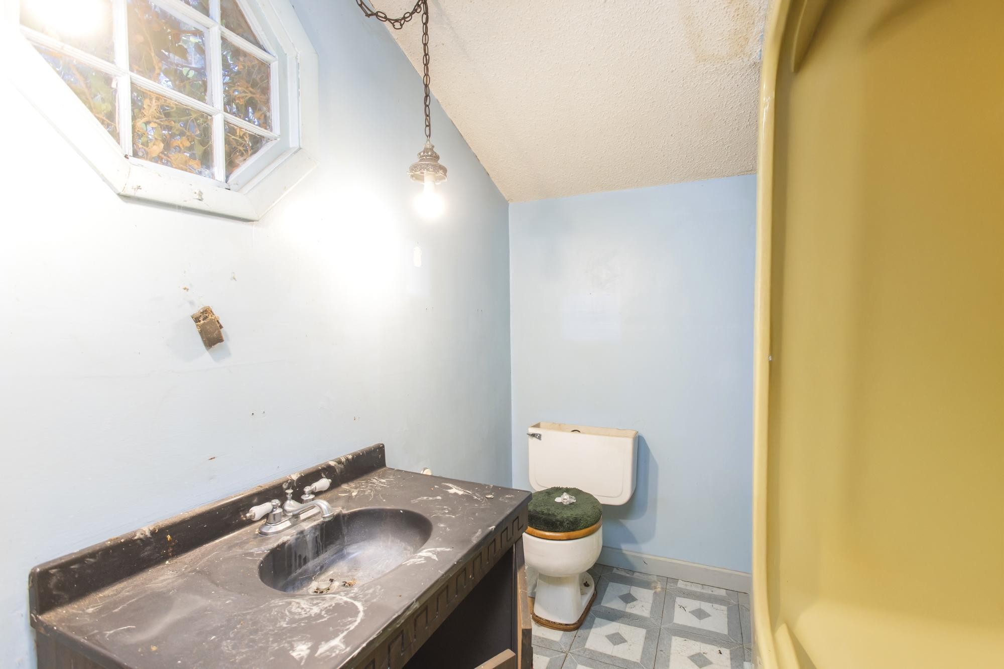 1700 Riverside Road Old Hickory, TN 37138 - Photo 36 of 59 a bathroom with a sink and a toilet