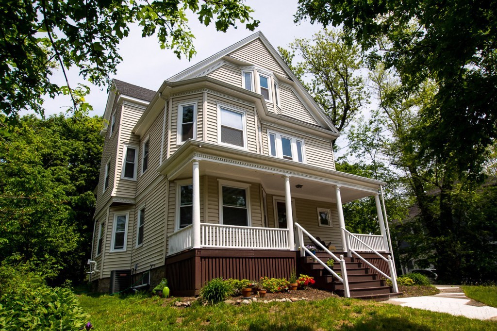 a front view of a house with a yard