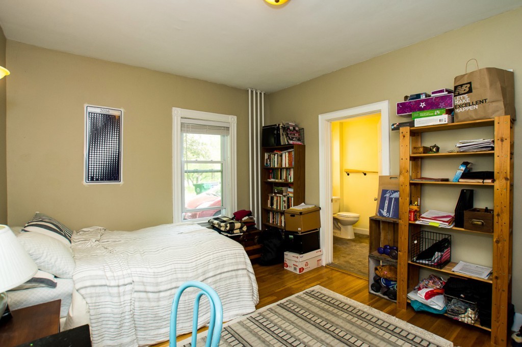 228 Langley Road Newton, MA 02459 - Photo 11 of 30 a bedroom with a bed and a window