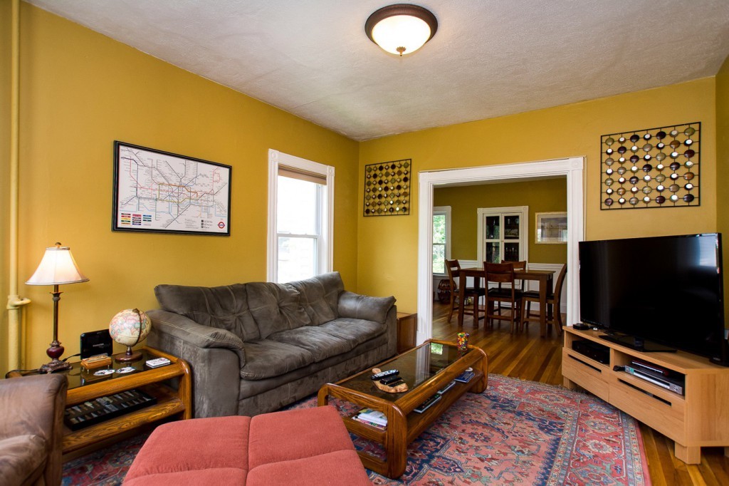 228 Langley Road Newton, MA 02459 - Photo 14 of 30 a living room with furniture and a flat screen tv