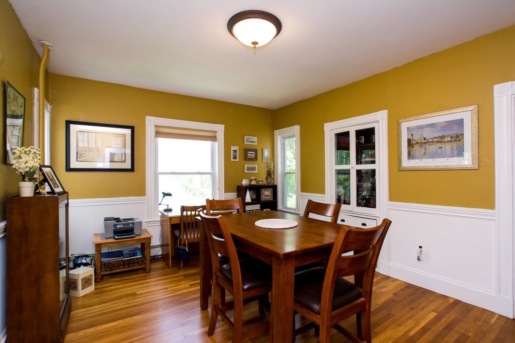 228 Langley Road Newton, MA 02459 - Photo 16 of 30 a view of a dining room with furniture and wooden floor