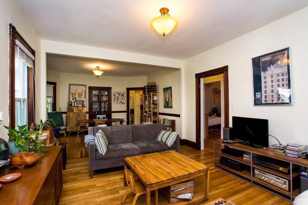 228 Langley Road Newton, MA 02459 - Photo 2 of 30 a living room with furniture and a flat screen tv
