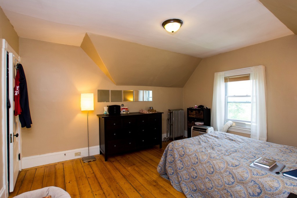228 Langley Road Newton, MA 02459 - Photo 27 of 30 a bedroom with a bed and a dresser