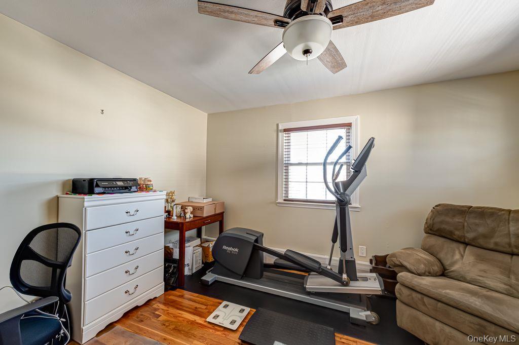 89 Cheltenham Road West Babylon, NY 11704 - Photo 15 of 26 a living room with furniture and a window