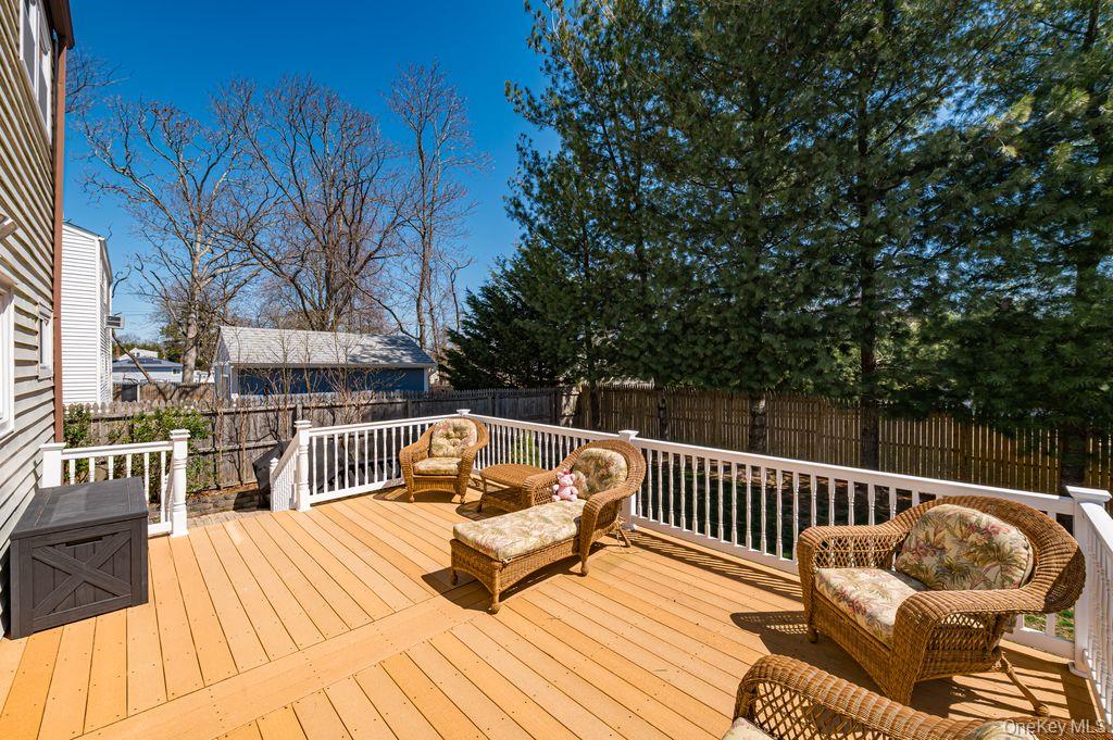 89 Cheltenham Road West Babylon, NY 11704 - Photo 18 of 26 a balcony with wooden floor and furniture
