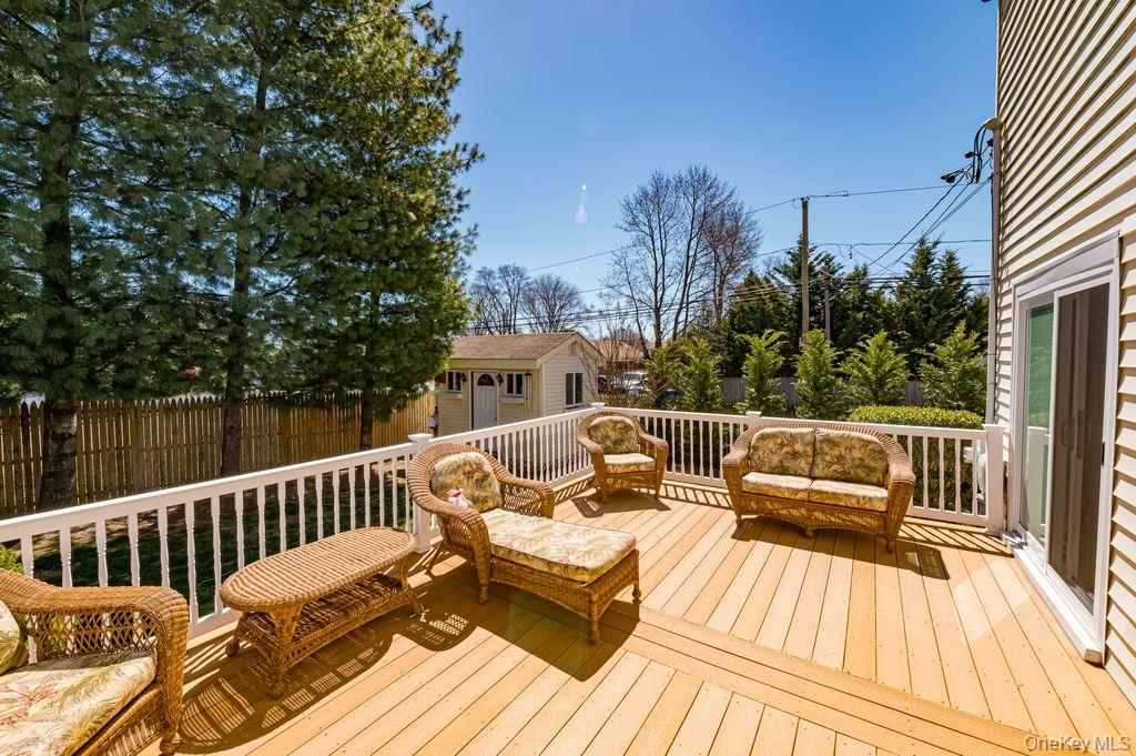 89 Cheltenham Road West Babylon, NY 11704 - Photo 19 of 26 a view of a balcony with wooden floor and outdoor space
